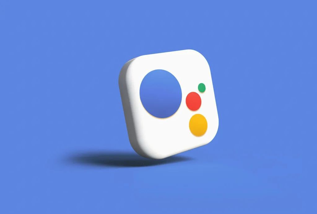 The Google Assistant logo is displayed on a white background with the text 'Rise of Voice Search and Its Implications for SEO' incorporated into the image. The logo features a multi-colored circle with four dots, resembling a microphone, indicating the voice-activated nature of the Google Assistant. The background is a plain white, allowing the logo to stand out prominently.